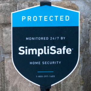 simplisafe sign with text reading home security